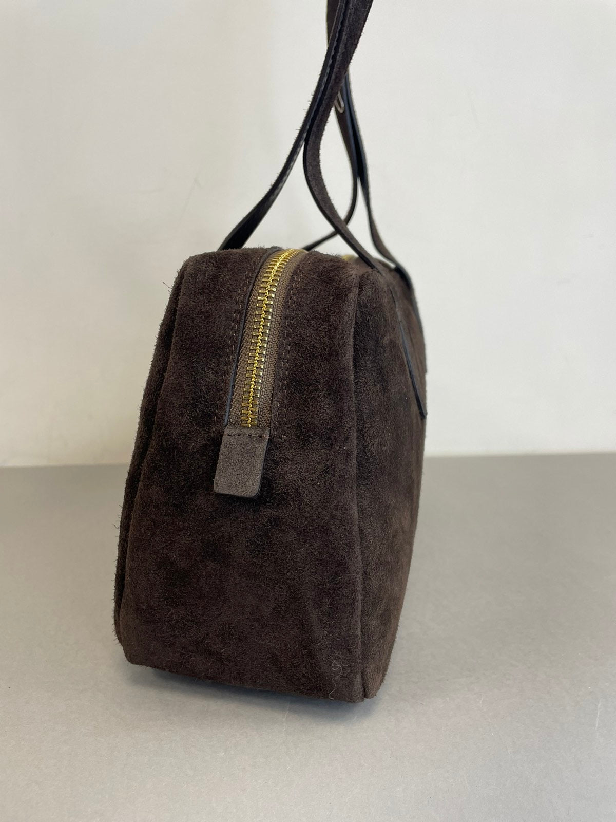 Ruda natūralaus zomšo rankinė